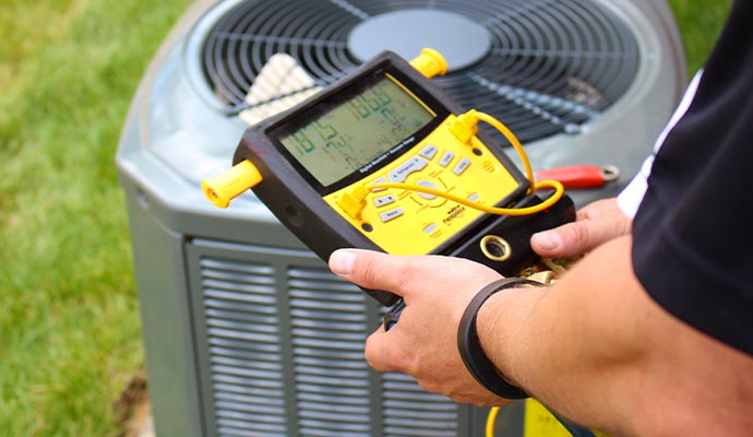 A person is testing AC refrigerant