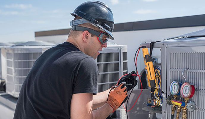Person repairing ac component