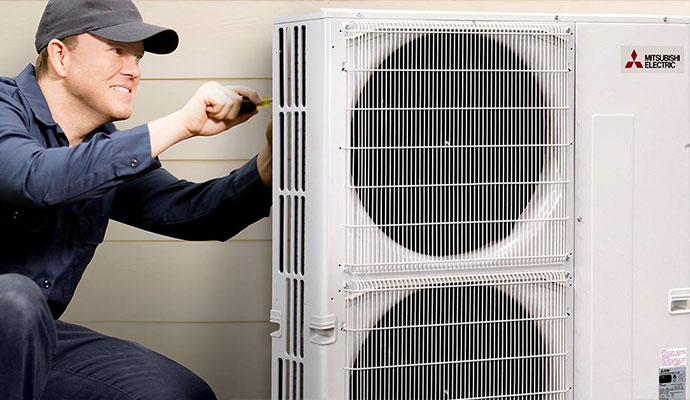 A professional repairing an AC unit