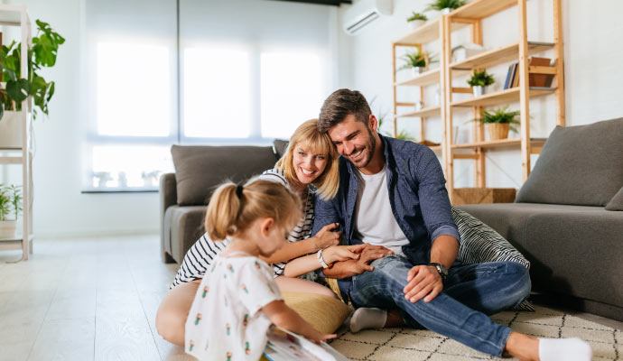 A happy family sitting together in the living room