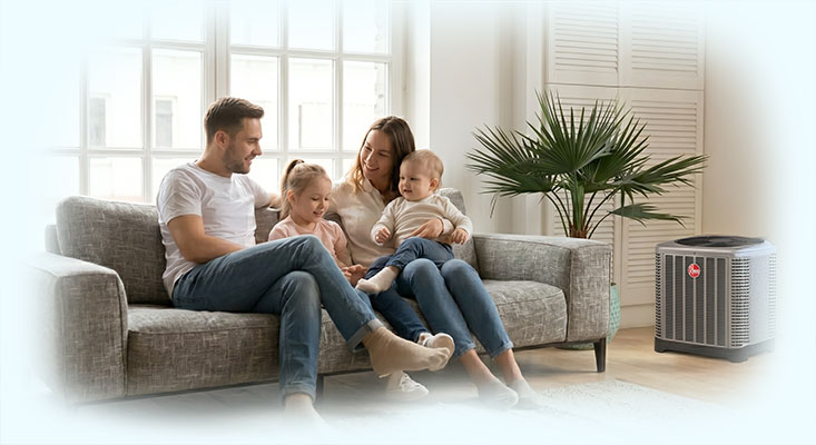 Happy family in the living room enjoying comfort heating