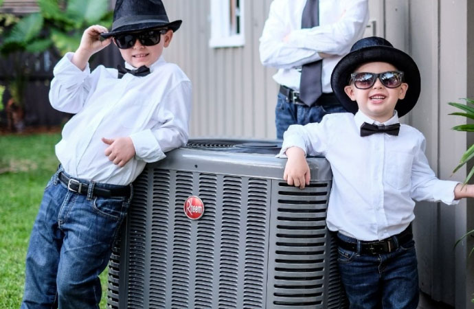A happy child with their outdoor unit.
