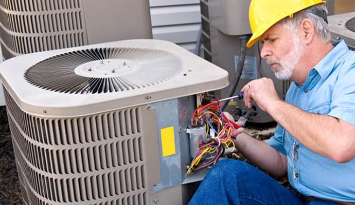 Person repairing a heater with equipment