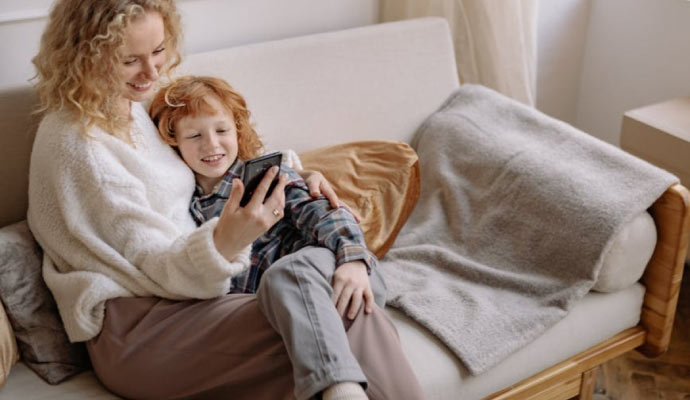 Happy mother and son relaxing in room with good air quality