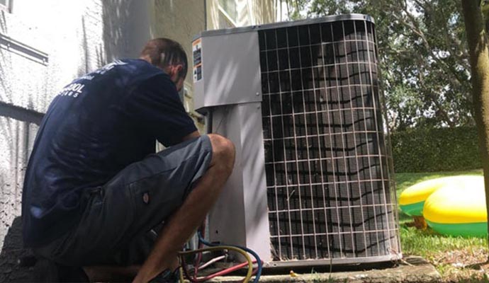Person repairing HVAC system