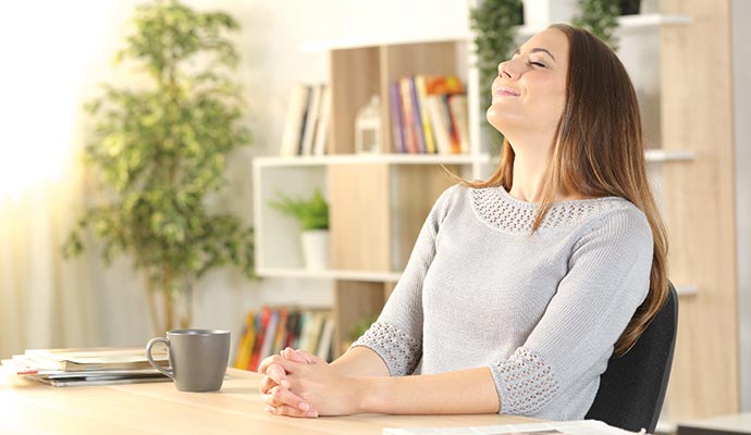 A person is breathing healthy air in living room