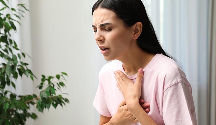 Woman experiencing breathing problem