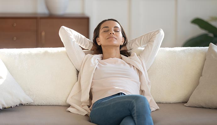 Woman relaxing on sofa