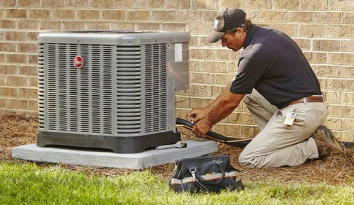 Person repairing an HVAC system