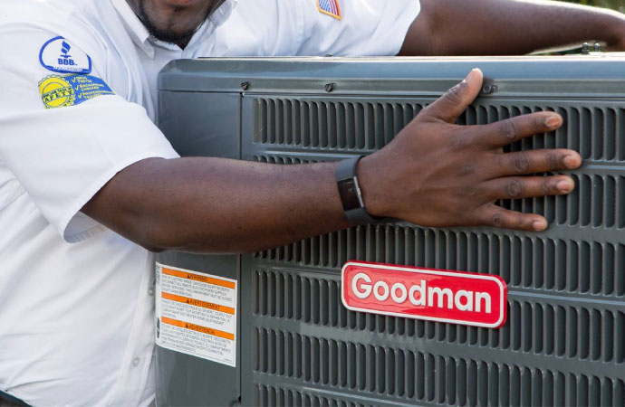worker holding hvac product
